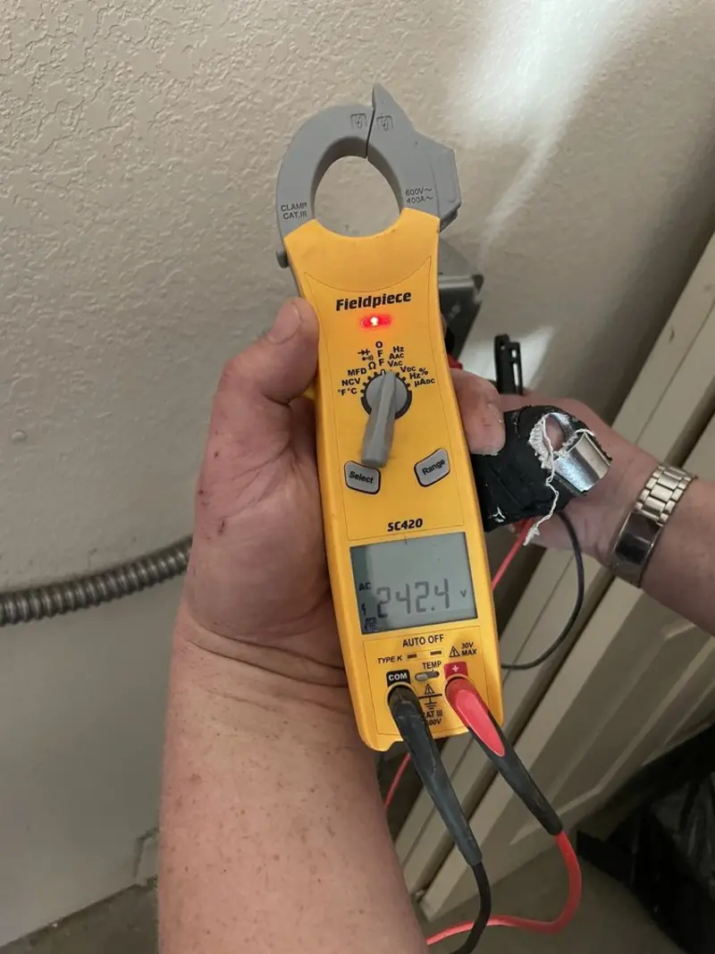 Voltage testing with clamp meter during Electrical Installation Services in Madison Heights